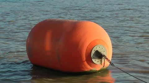 Orange buoy bobbing on water Stock Footage 46805512
