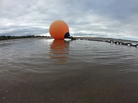 Orange buoy with chain on the sandy beach Stock Footage 151655849