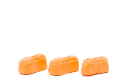 Orange Candy Peanuts on a White Background Stock Photos