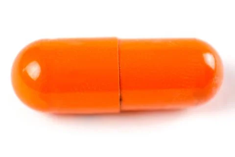 Orange capsule. Macro. Closeup 库存照片