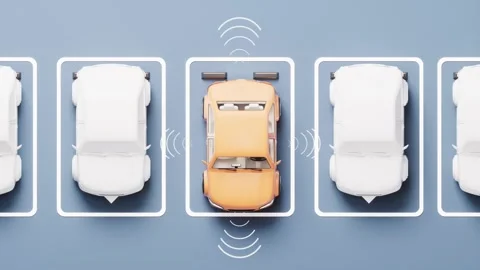 Orange car performing automatic parallel parking maneuver between white veh.. Video stock 327524426