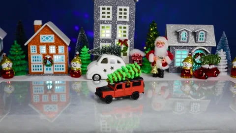 The orange car quickly drives away from the Christmas town Stock Footage 308568731