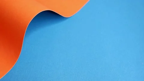 Orange cardboard on a blue background. Stock Footage 157275156