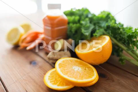 Orange with carrot juice, fruits and vegetables Stock Photos
