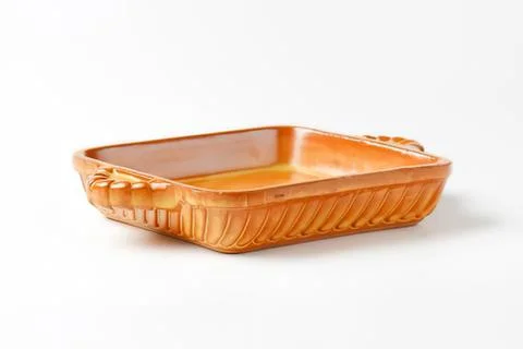 Orange ceramic baking dish with handles Stock Photos