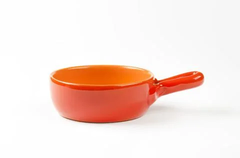 Orange ceramic spoon rest or ramekin with handle Photos