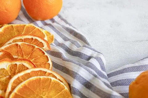 Orange chips on a gray background, close up. Fruit chips. A healthy snack. Stock Photos