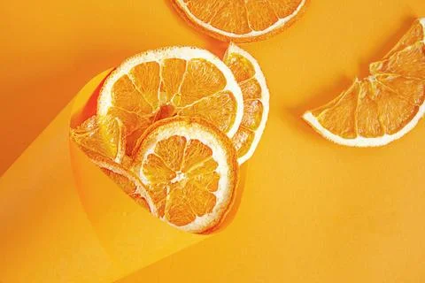Orange chips orange background. Fruit chips. Healthy snack Stock Photos