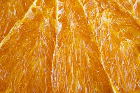 Orange chips texture, macro. Fruit chips. A healthy snack. Stock Photos