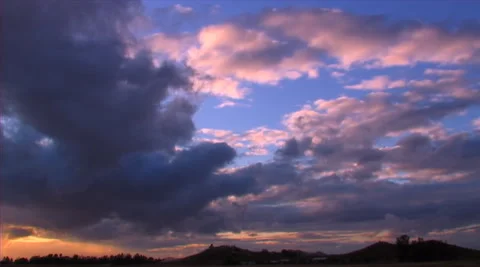 Orange cirrus stratus clouds on dark blue sky. Stock Footage 281850900