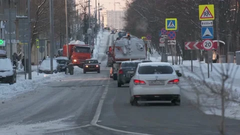 Orange city snow plows moving on city street at the winter Video stock 156208035