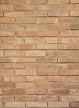 Orange clay bricks wall background. Bricks backdrop Stock Photos