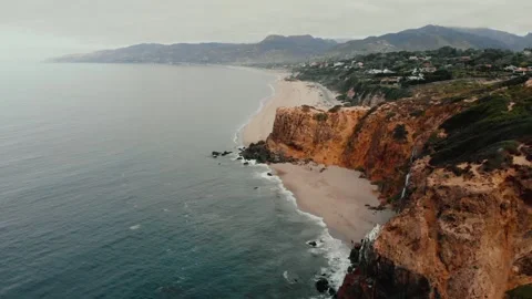 Orange cliffs and blue ocean drone shot in California Stock Footage 241362483