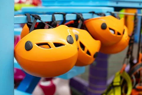 Orange Climbing Helmets on Display Stock Photos
