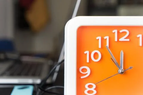 Orange clock is counting to Lunch break Stock Photos