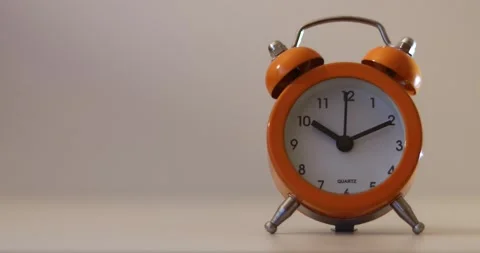 Orange The clock sets the time to 10.00. on white background 4k. Stock Footage 300364243