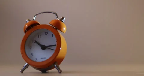 Orange The clock sets the time to 10.00. on white background 4k. Stock-Footage 300364418