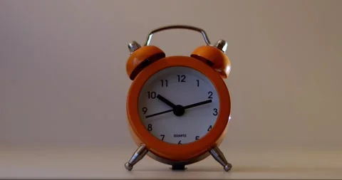 Orange The clock sets the time to 10.00. on white background 4k. Stock-Footage 300364488