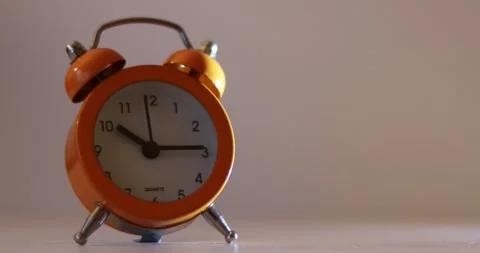 Orange The clock sets the time to 10.00. on white background 4k. Stock-Footage 300364516