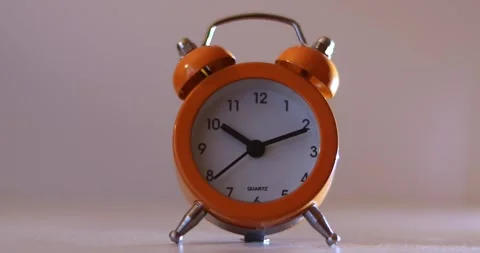 Orange The clock sets the time to 10.00. on white background 4k. Stock-Footage 300364550