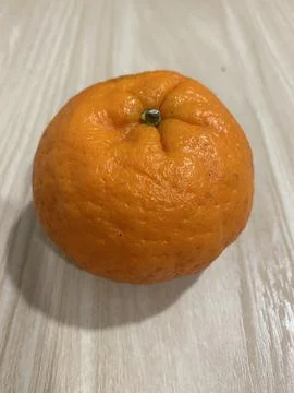 A orange close up with textured on the table Stock Photos