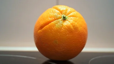 Orange in the closeup in front of white background Stock Footage 120417921