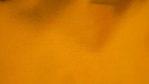 Orange cloth texture as background Stock Photos