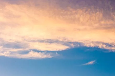 Orange cloud on blue sky at sunset Stock Photos