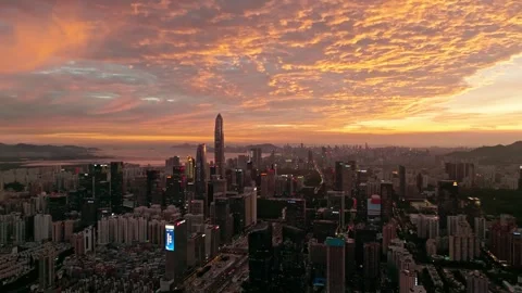Orange cloud patterns above the city skyline - Shenzhen Stock Footage 346623638