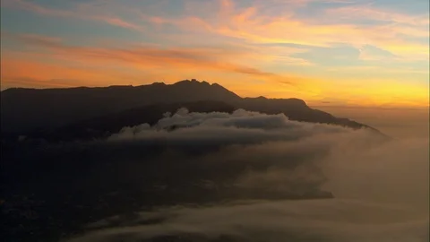Orange clouds and distant mountains at dawn, Dawn Over The Amalfi Coast Stock Footage 108573113