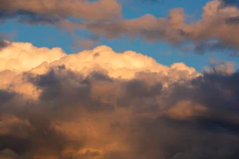 Orange clouds and sky background at golden hour time. Sunset Stock Photos