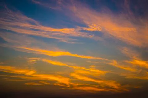 Orange Clouds In The Blue Sky Stock Photos