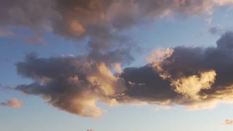 Orange clouds in the blue sky at sunset Stock Footage 134245939