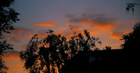 Orange clouds during sunset moving Stock Footage 90952821