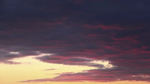 Orange clouds rolling in the sky during sunset Stock Footage 73011462