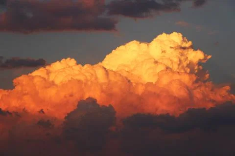 Orange clouds at sunset Stock Photos