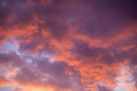 Orange clouds at sunset Stock Photos