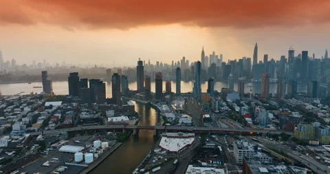 Orange cloudscape covering the sky above New York. Sunset in the metropolis. Stock Footage 247167351