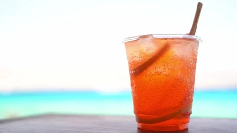 Orange Cocktail On The Beach Stock Footage 244864276