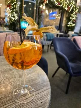 Orange cocktail in elegant lounge setting Фото