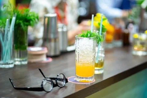 Orange cocktail with ice and dill Stock Photos