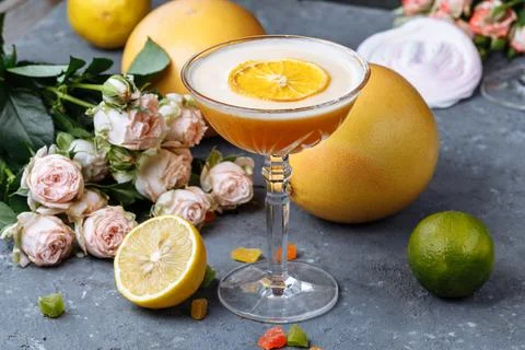 Orange cocktail with a slice of orange on a black concrete background. Summer 스톡 사진