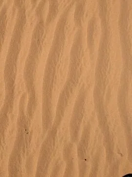 Orange color sand texture pattern background. Wadi Rum desert, Jordan,Arabia Stock Photos