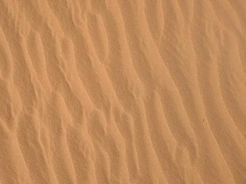 Orange color sand texture pattern background. Wadi Rum desert, Jordan,Arabia Stock Photos
