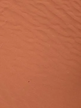 Orange color sand texture pattern background. Wadi Rum desert, Jordan,Arabia Stock Photos