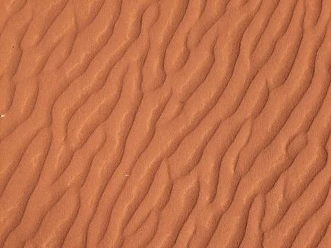 Orange color sand texture pattern background. Wadi Rum desert, Jordan,Arabia Stock Photos