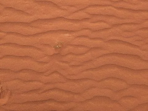 Orange color sand texture pattern background. Wadi Rum desert, Jordan,Arabia Stock Photos