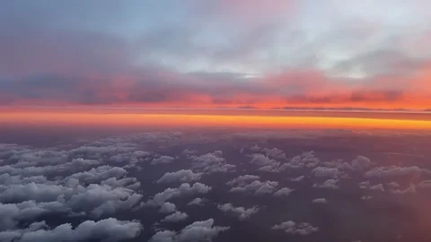 Orange Color Sky: Flying Between Layers of Clouds at Dawn. Aerial Shot From a Stock Footage 304145829