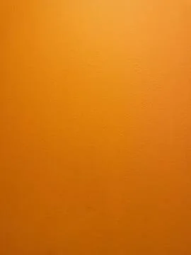 Orange colored background, bright abstract texture of painted cement wall 스톡 사진