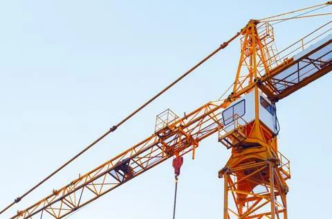 Orange colored building crane. 스톡 사진